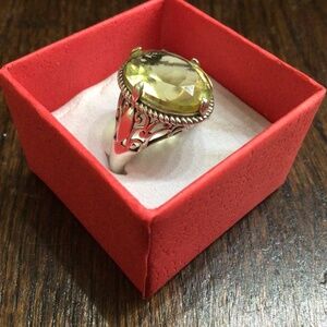 925 sterling silver Citrine stone ring with scrolled edges. Size 8.